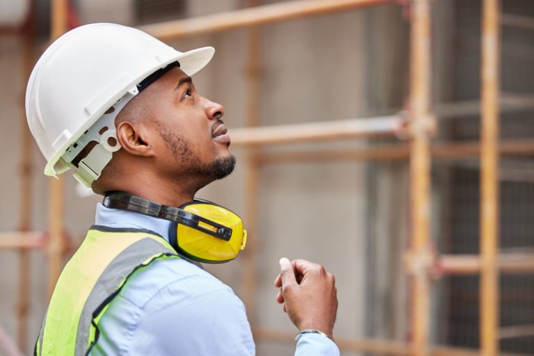 shot of a young man working on a construction site outside
